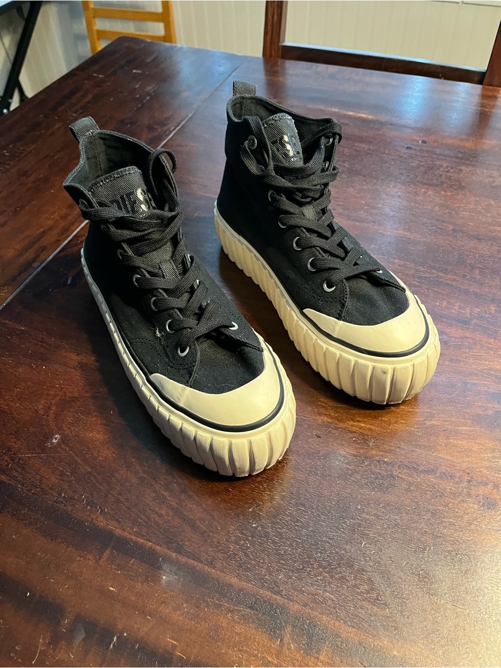 Diesel Black High-Top Sneakers with Cream Soles and Toe Caps
